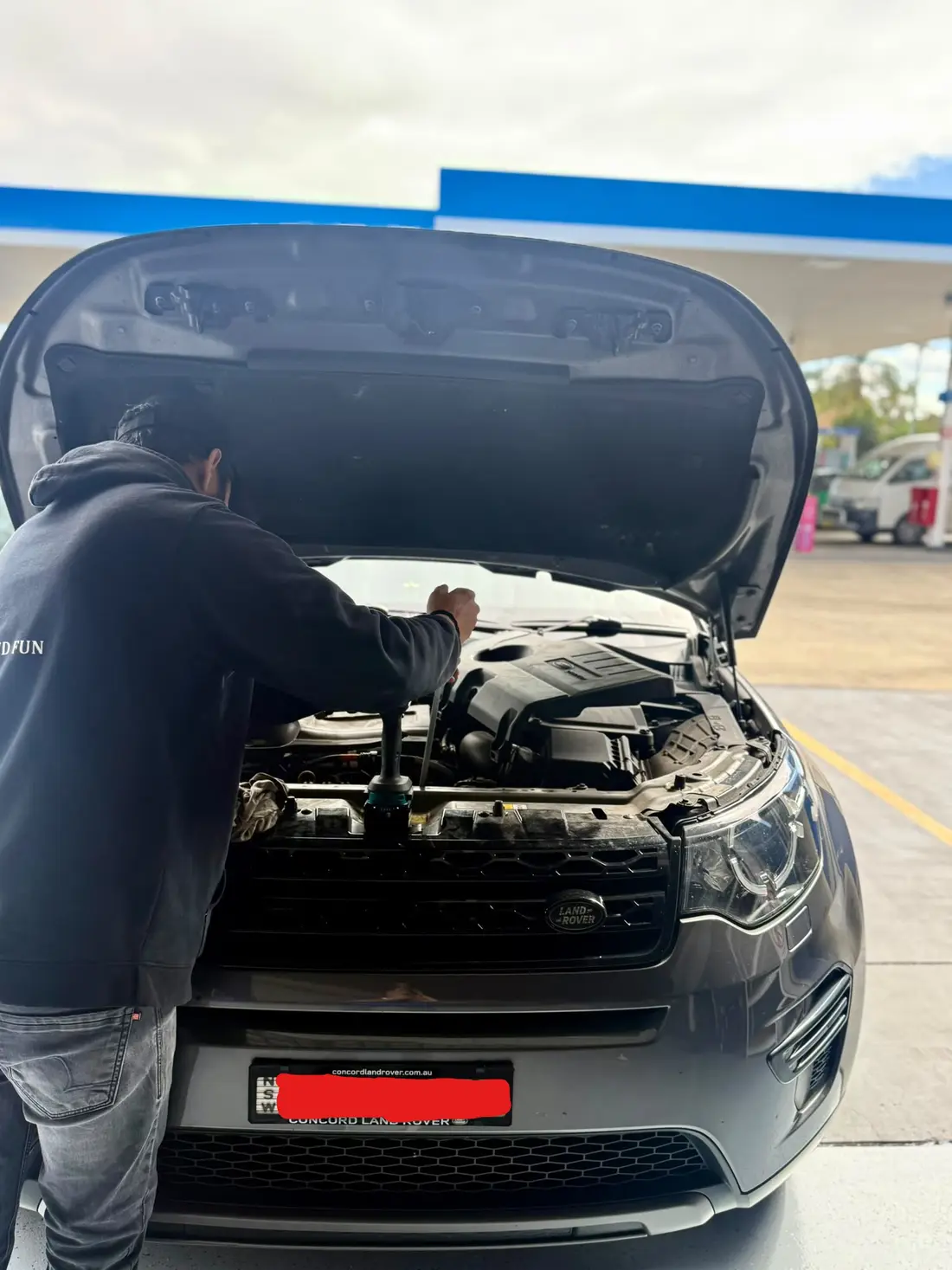 Mechanic working under a bonnet